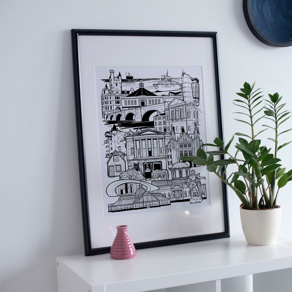 Black and white Aberdeen illustration print in frame with plant